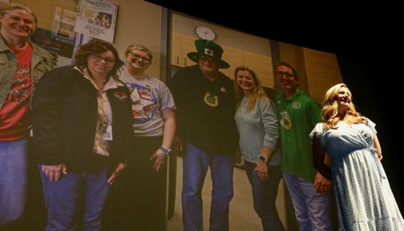 Kings County educators celebrated at 42nd Annual Excellence in Education Awards held April 18 in Hanford's Fox Theater Central Union Honoree Carrie Dozier stands as slide show is projected.